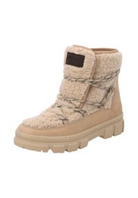 Stivale beige con texture in pile, caratterizzato da un design con lacci e una suola robusta in gomma. Un'etichetta marrone è visibile sul lato.