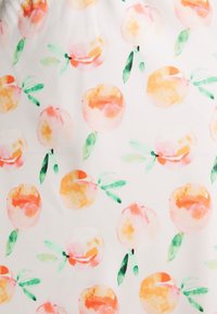 Light fabric featuring a repeating pattern of peaches in soft orange and pink hues, accented with green leaves on a white background.