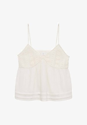 White camisole with thin straps, featuring a textured bodice and a flowing, sheer bottom. Accented with two horizontal fabric bands near the hem.