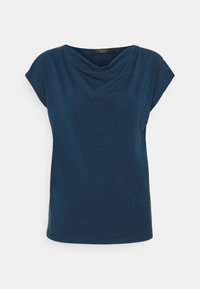 Mörkblå kortärmad damtröja med dämpad rund halsringning, löst sittande passform och enkel fåll, visad mot en vit bakgrund.
