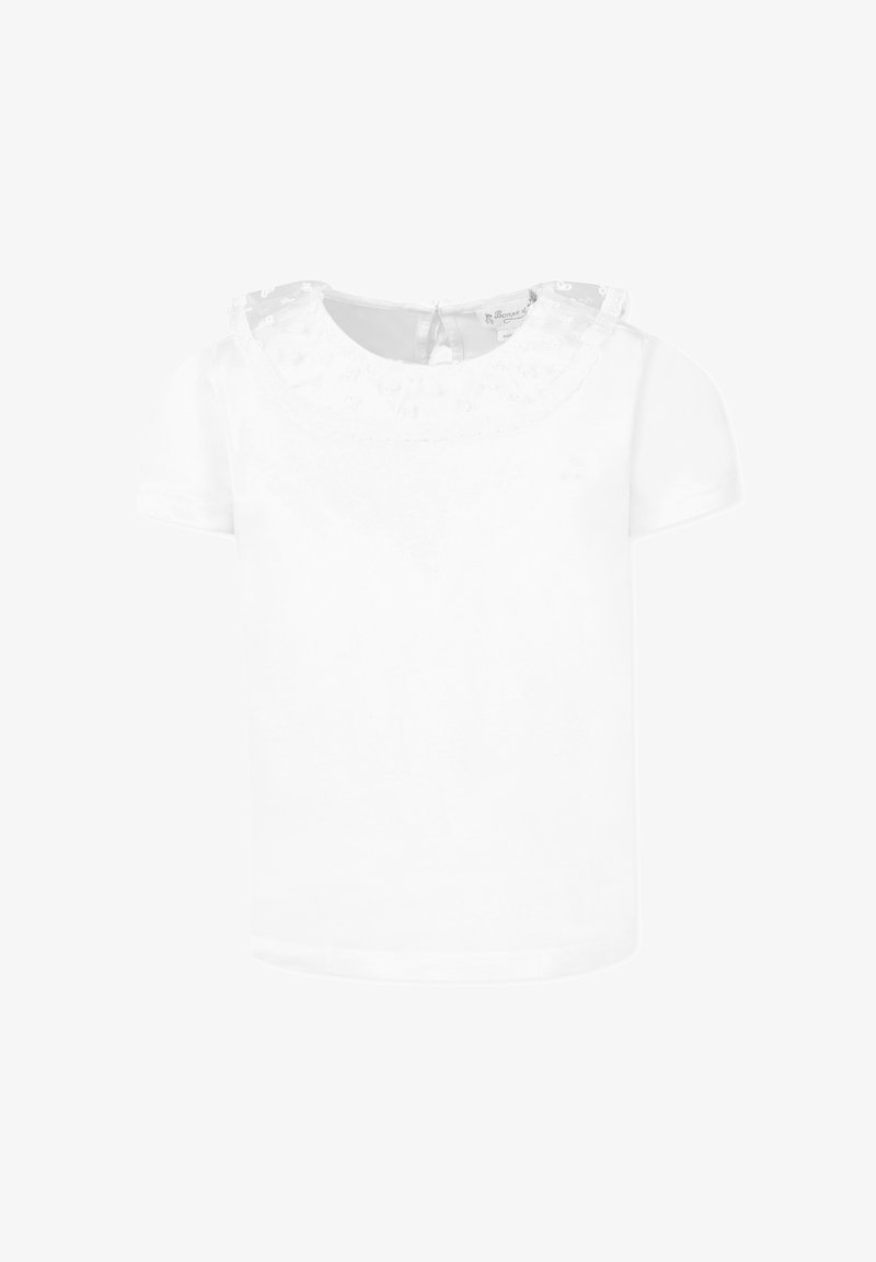 Biała koszulka z krótkim rękawem i okrągłym dekoltem. Posiada koronkowy nadruk o fakturze oraz zapięcie na guziki z tyłu. Wykonana z miękkiej bawełny.
