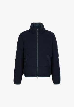 Pufferjack in donker marineblauw, met een hoge kraag, ribgebreide manchetten en zijzakken. Geverfde stof met een ritsluiting.