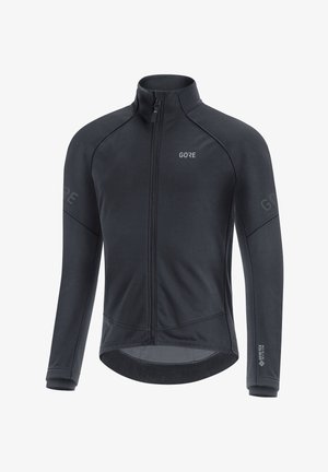 Veste de cyclisme noire à manches longues avec fermeture éclair frontale, col montant et logo Gore-Tex Infinium sur la manche droite et la poitrine.
