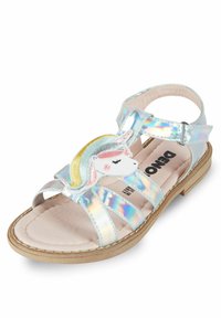 Iridescentt sandaalit, joissa on useita läpinäkyviä hihnoja, etuosassa yksisarvinen-patch ja pehmustettu beige pohjallinen.