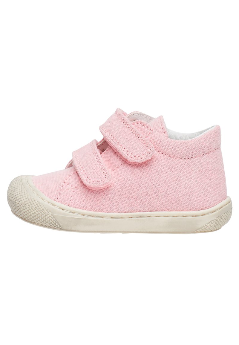 Pink canvas shoe with double Velcro straps, round toe, and textured rubber sole. Features a padded collar and contrasting white trim.