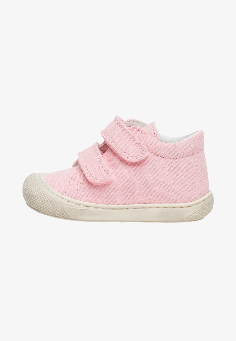 Pink canvas shoe with double Velcro straps, round toe, and textured rubber sole. Features a padded collar and contrasting white trim.