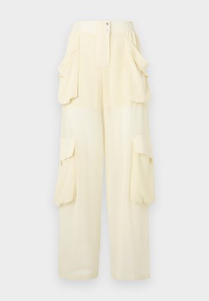 Light yellow cargo pants with an elastic waistband, two large side pockets, and a smooth texture. Features a button closure at the front.