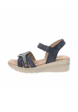 Infradito blu navy con una tomaia testurizzata, cinturino alla caviglia regolabile e un accentuazione decorativa di strass. Presentano una suola a piattaforma per il comfort.