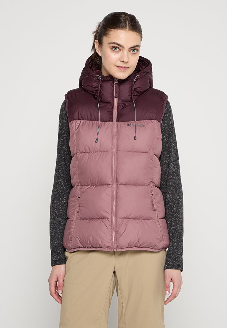 Sleeveless puffer vest featuring a two-tone design in dark purple and mauve, with a high collar, zipper closure, and two side pockets.