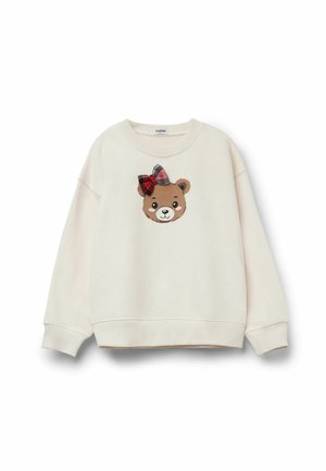 Sweatshirt couleur crème avec un col rond, présentant une application de visage d'ours avec un nœud à carreaux rouges et noirs sur le front.