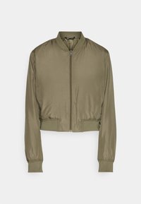 Zkrácená bomber bunda v olivově zelené barvě, vyrobená z hladké tkaniny. Má přední zip, žebrované manžety a žebrovaný lem.