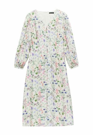 Blommig klänning med v-ringning, långa puffärmar och knälång silhuett. Har flerfärgade blommönster på en ljus bakgrund.