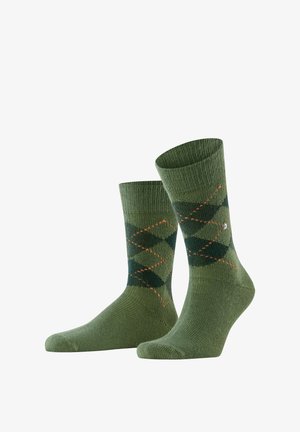 Calzini verdi con un motivo a rombi in verde scuro e accenti arancioni. Composti da un tessuto a maglia testurizzata, con polsini a coste.