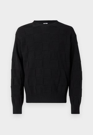 Čierny pletený sveter s textúrovaným štvorcovým vzorom, okrúhlym výstrihom a rebrovanými manžetami a lemom. Mäkký materiál s voľným strihom.