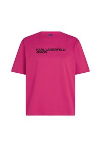 Rózsaszín pamut póló, rövid ujjakkal, kerek nyakkivágással és fekete "KARL LAGERFELD JEANS" felirattal az elején.