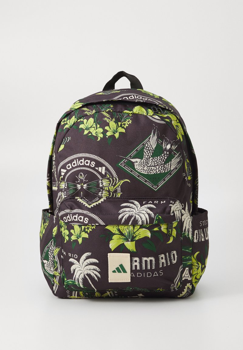Black backpack featuring a tropical floral print in green and white, with a front pocket and branded accents. Constructed from durable fabric.