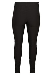 Czarne legginsy wykonane z elastycznego materiału, z wysokim stanem, gładką strukturą i zwężanymi nogawkami, bez widocznych szwów i wzorów.