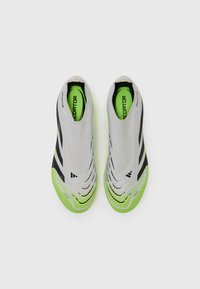 Gray and black slip-on shoes with green accents. Textured upper with stripes, round toe, and a rubber sole. Lightweight design.