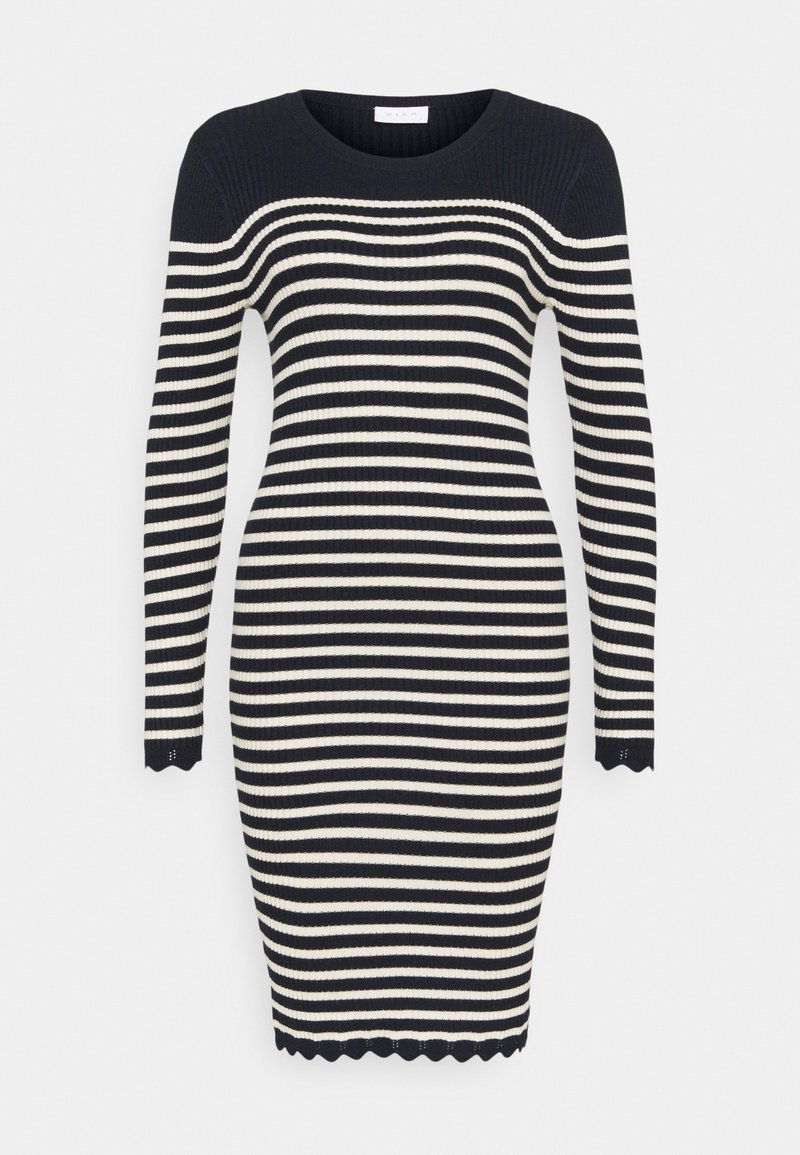 Robe en maille à manches longues, longueur genou, avec des rayures horizontales noires et blanches et des bords festonnés aux poignets et à l'ourlet.