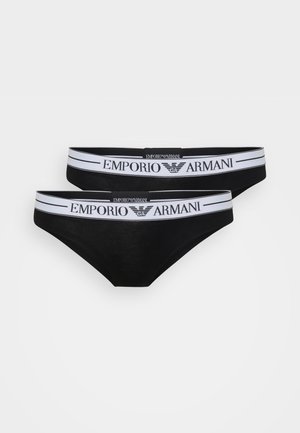 Ensemble de sous-vêtements en coton noir avec une taille logo portant "EMPORIO ARMANI" en blanc. Le design présente une texture lisse et une coupe brief.
