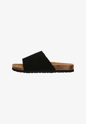 Sandal en daim noir à enfiler avec une semelle en liège, présentant une large sangle inclinée et une semelle en caoutchouc texturée pour une bonne adhérence.