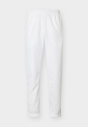 Pantalones jogger con cintura y tobillos elásticos blancos, de tela lisa y sin bolsillos ni adornos visibles.