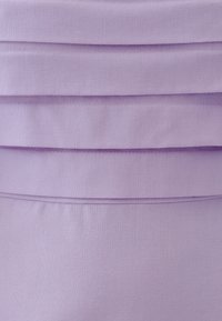 Light purple fabric with a smooth texture features three horizontal pleats. The stitching is concealed, creating a clean line across the design.
