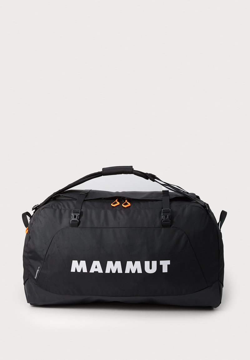 Black duffel bag with a large white brand logo, featuring orange zipper pulls, adjustable straps, and a textured fabric surface.