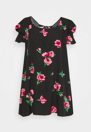 Robe noire à manches courtes avec imprimé floral rose et vert et manches froncées, avec un petit lien à nouer dans le dos au niveau de l'encolure.