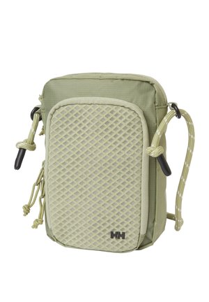 Pequeño bolso bandolera verde oliva con bolsillo de malla frontal, tiradores de cremallera dobles, correa ajustable de cordón y logo HH negro en la esquina inferior.