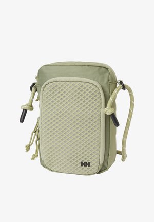 Pequeño bolso bandolera verde oliva con bolsillo de malla frontal, tiradores de cremallera dobles, correa ajustable de cordón y logo HH negro en la esquina inferior.