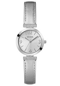 Hõbedatooniline kell metallist rihmaga, ümar nägu ja tekstureeritud kellapind. Kellal on rhinestone aktsendid rihma kinnituskohas.