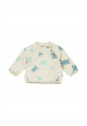 Maglione per neonato a manica lunga color crema con stampe di tartarughe blu e gialle e tre bottoni marroni vicino alla spalla sinistra.
