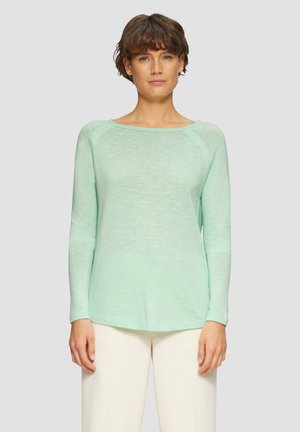 Long-sleeve, mint green top in lightweight, textured fabric. Features a round neckline and a relaxed fit with side slits at the hem.