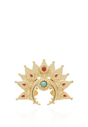 Gold-toned crescent-shaped brooch with turquoise center stone, surrounded by ornamental sunray design with red enamel accents.