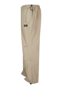 Pantalons cargo beige en coton avec une ceinture élastique, poches latérales, jambes droites et poignets ajustables aux chevilles.