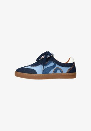 Blue denim sneaker with contrasting light blue and tan accents, round toe, lace-up design, and textured gum rubber sole.