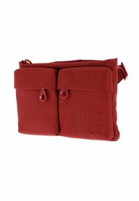 Red fabric crossbody bag with two front pockets, each with a button closure. Features a smooth texture and adjustable strap.