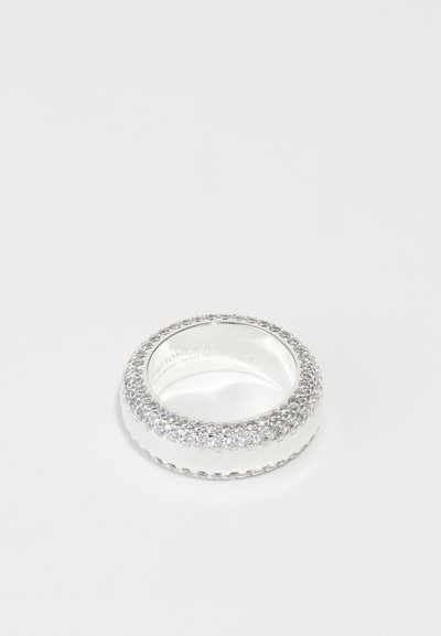 Silver ring with a smooth band, featuring a row of clear crystals along the top edge, glossy finish, and textured detailing on the sides.