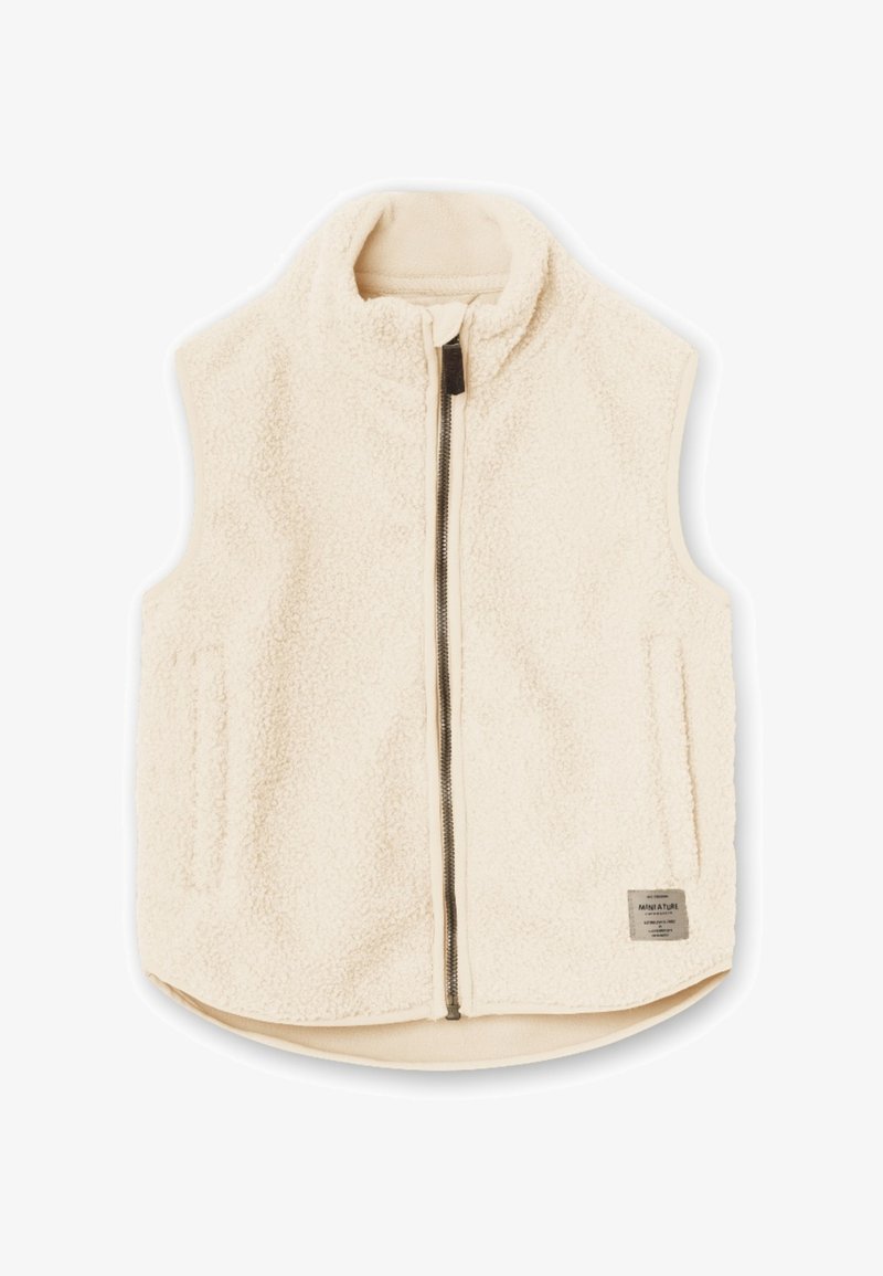 Cream fleece vest with high collar, full front zipper, two side pockets, and a small label on the bottom right. Smooth inner lining.
