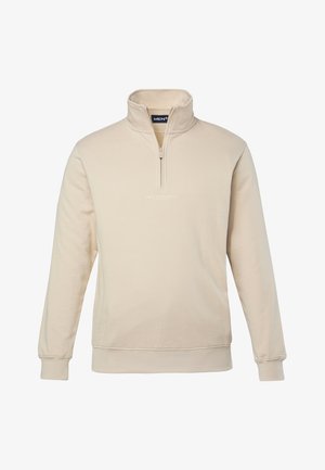 Beige zip-up sweatshirt in soft fabric, featuring a high collar, ribbed cuffs, and a small logo on the chest. Clean, minimalist design.