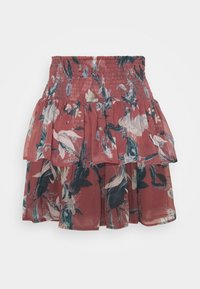 Jupe courte à volants avec une ceinture smockée, présentant un motif floral dans des tons roses, verts et blancs atténués.