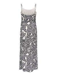 Robe longue sans manches avec fines bretelles, avec un motif abstrait de feuilles en noir et blanc et une doublure intérieure de couleur claire en haut.