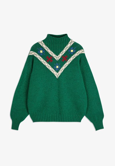 Zeleni pleteni pulover s visokim rebrastim ovratnikom. Ima V-oblikovani dizajn u krem boji, ukrašen crvenim, plavim i žutim cvjetnim uzorcima.