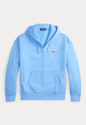 Svetlomodrá mikina na zips vyrobená z jemnej bavlnenej zmesi. Má klokanie vrecko, nastaviteľnú kapucňu so šnúrkou a vyšívané logo na hrudníku.