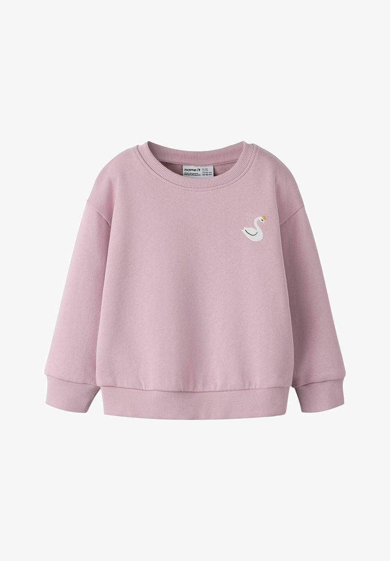 Różowa bluza z miękkiego materiału, z okrągłym dekoltem, ściągaczami przy rękawach oraz haftowanym białym łabędziem z przodu.