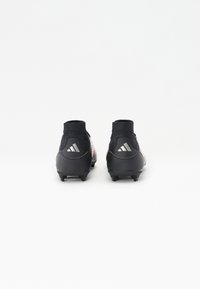 Black soccer cleats with a knit collar, featuring a textured upper and three white stripes logo on the heel. Studded outsole for traction.