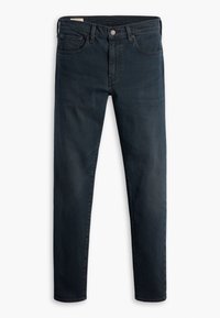 Jean slim bleu foncé avec bouton et fermeture éclair à l'avant, cinq poches et passants de ceinture, posé à plat sur un fond blanc.
