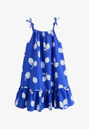 Blue sleeveless dress with white lemon prints, tied shoulder straps, and a ruffled hemline.