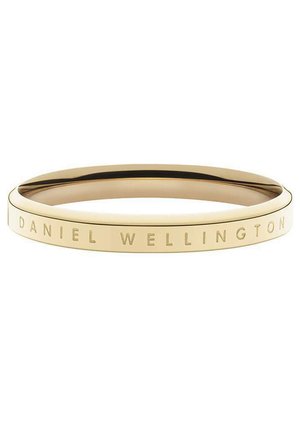 Goldfarbene Armspange mit einer glatten, glänzenden Oberfläche. Das Band verfügt über eingravierten Text "DANIEL WELLINGTON" und zeigt ein minimalistisches Design.